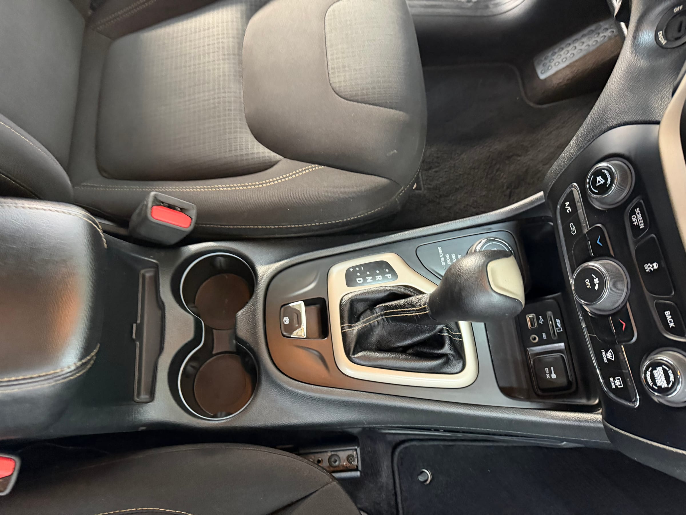 Same center console cleaned after Fitchin Automotive interior detail service — Coshocton, Ohio